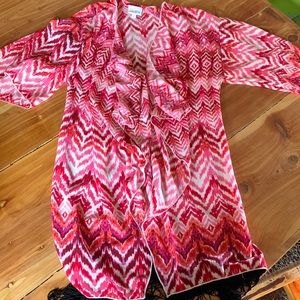 Size small hot pink Lularoe cover with black fringe.
